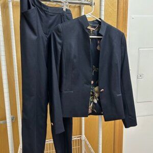 Blue Ted Baker pantsuit with standup collar and dual length pants hem